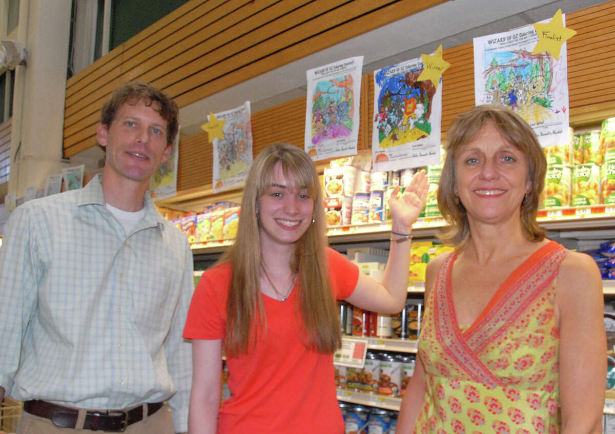 Alex Stewart, general manager of Walter StewartâÄôs, Lilla Goettler (Summer Theatre of New Canaan College Intern) and Melody Libonati, artistic director Summer Theatre of New Canaan choose a winner from more than 50 coloring entries.