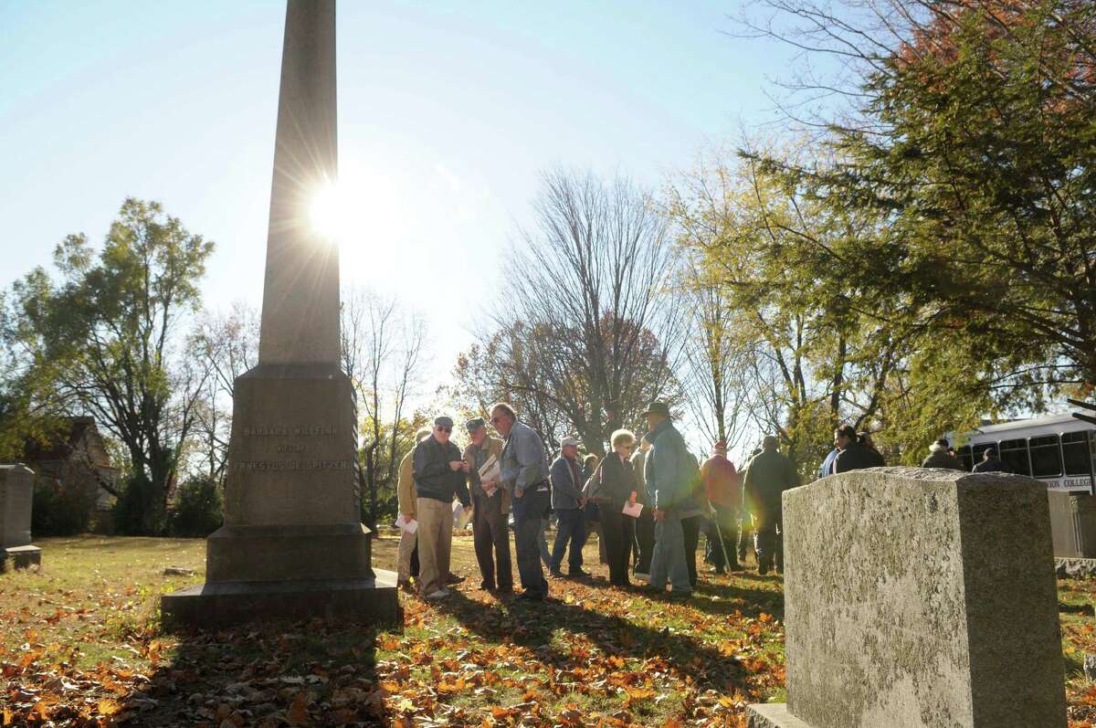 History Professor Tom Kelly, far left, leads a tour during the Vale & Valor event at Vale Cemetery in Schenectady, NY on Sunday, Nov. 7, 2010. The grave Kelly is stand near is that of Ernest DeSpitzer, a German immigrant clergyman and physician for fought in the French and Indian War and became a Surgeon General of the Provincial Forces. The Vale & Valor was a tour of the cemetery noting along the way certain graves of soldiers who fought in the great military conflicts from 1775-1945. The cemetery runs different tour programs from April to November each year. (Paul Buckowski / Times Union)