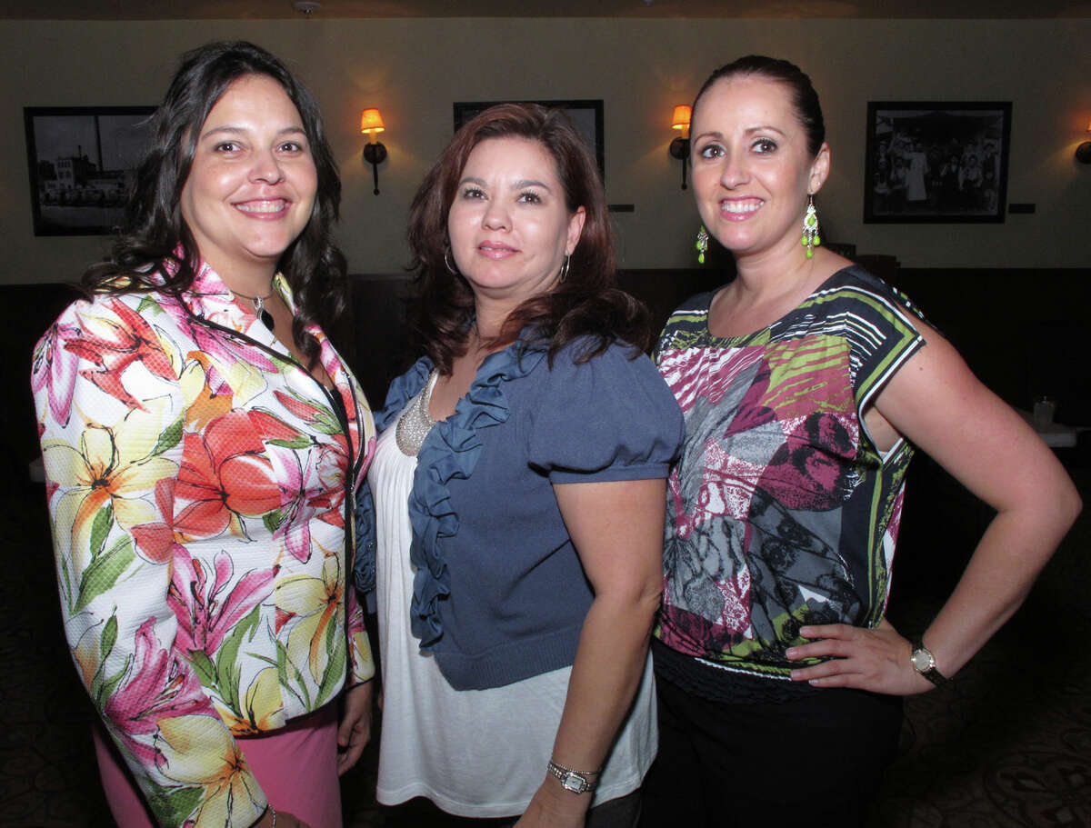 OTS/HEIDBRINK - Participants Maureen Molina, from left, Laura Guzman and Hilda Chavez gather at the Hispanic Chamber of Commerce Small Business Symposium at the Pearl Stable on 6/20/2012. names checked photo by leland a. outz