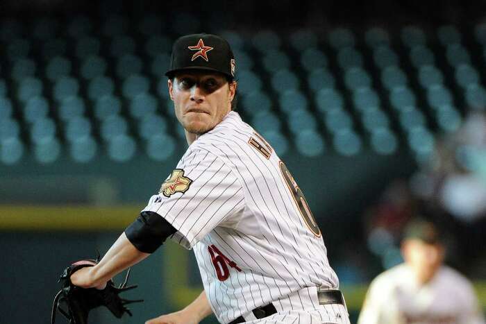 Houston Astros starting pitcher Lucas Harrell receives a new ball