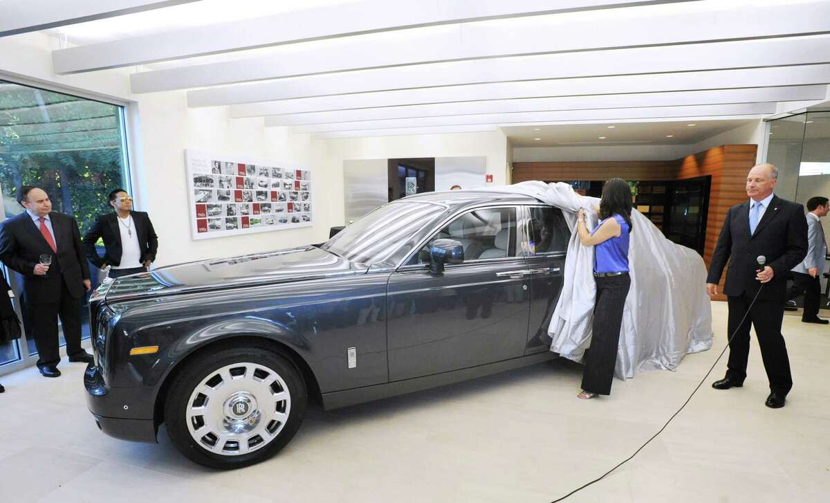 At right, David Archibald, president of Rolls-Royce Motor Cars North America, during the unveiling ceremony of the Rolls-Royce Phantom Series II in the recently renovated showroom at Rolls-Royce Motor Cars Greenwich Wednesday night, June 27, 2012.