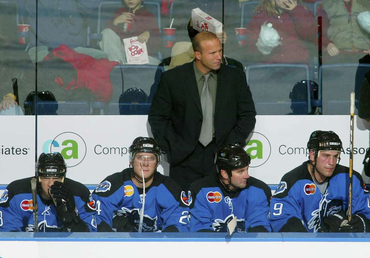 BRIDGEPORT, CT - NOVEMBER 13: Head Coach Greg Cronin of the Bridgeport Sound Tigers looks on from the bench during the game against the Norfolk Admirals at the Arena at Harbor Yard on November 13, 2004 in Bridgeport, Connecticut. The Sound Tigers defeated the Admirals 3-2. (Photo by Bruce Bennett/Getty Images)