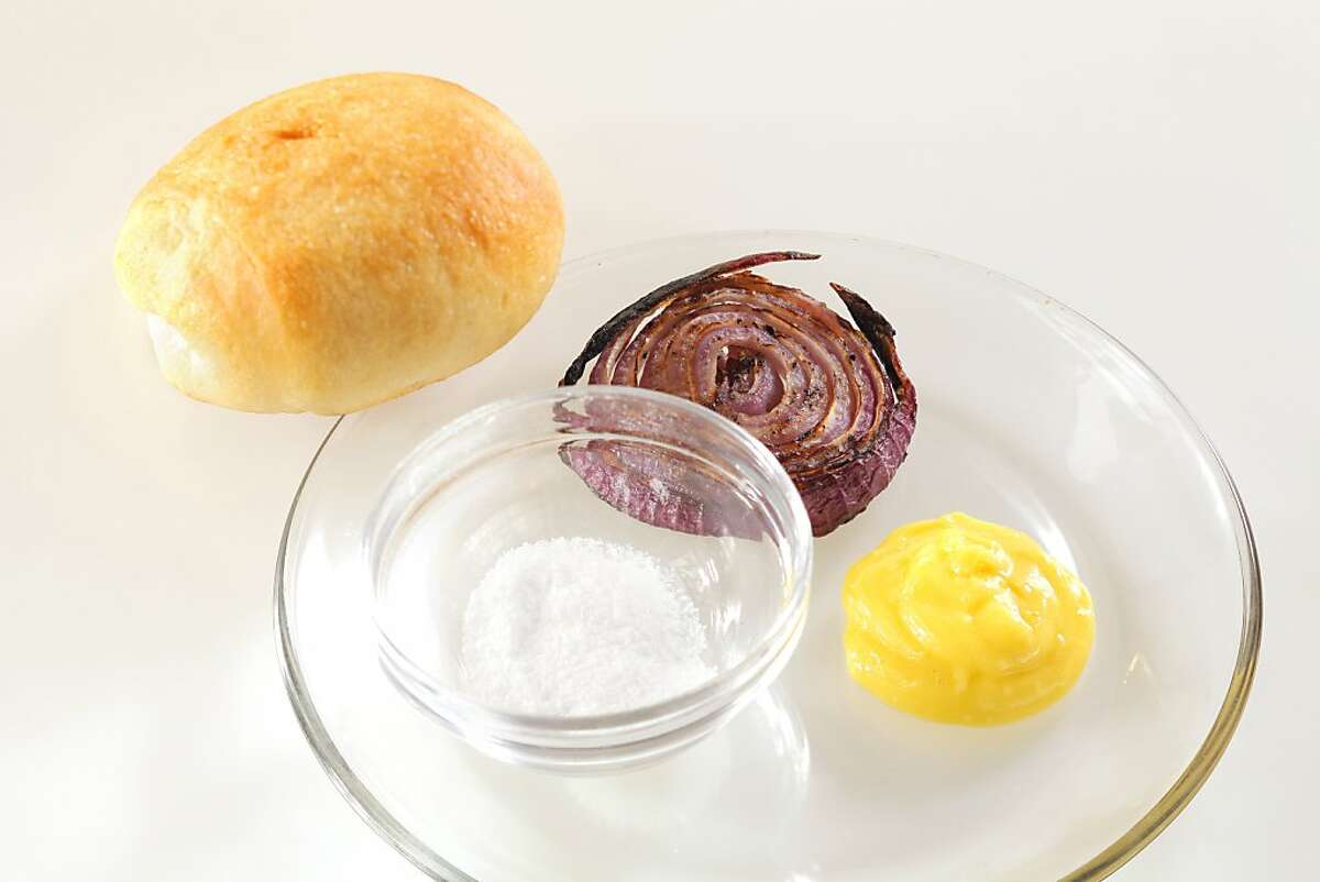The bun, the 30/70 ratio, the generous slather of aioli, the salt and the onion as seen in San Francisco, California, Wednesday, June 27, 2012. This is the secret ingredients of the Bistro Don Giavanni Burger.