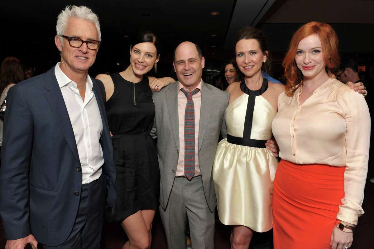  Matthew Weiner (center) with cast members from "Mad Men."  