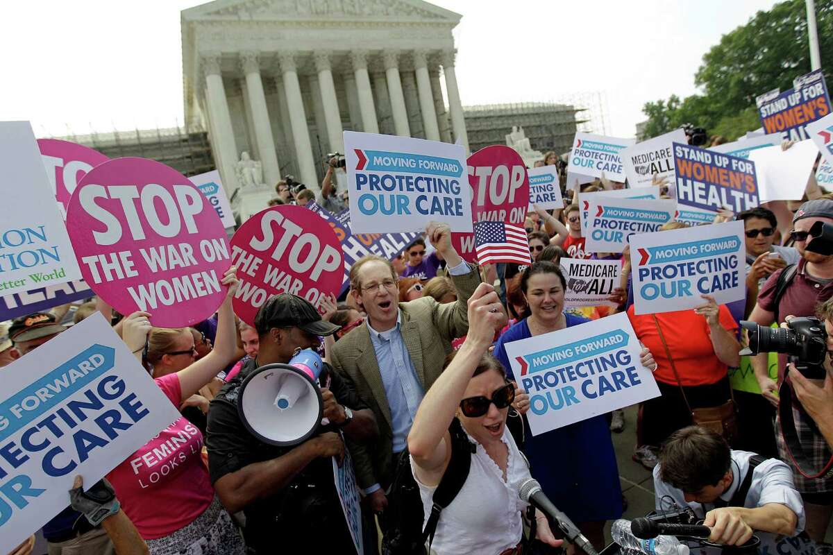 Affordable Care Act supporters celebrate outside the U.S. Supreme Court.