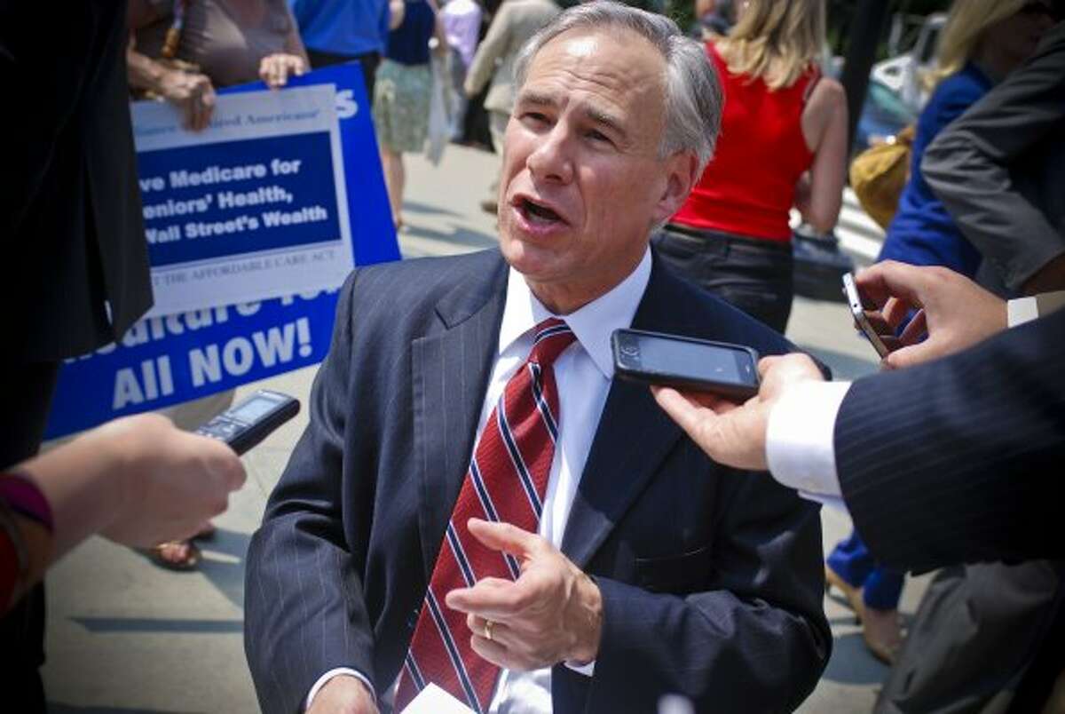 Texas Attorney General Greg Abbott spoke with members of the media following the justices' ruling, stating his belief that the battle over healthcare legislation was 'far from over.' (Francis Rivera / The Houston Chronicle )