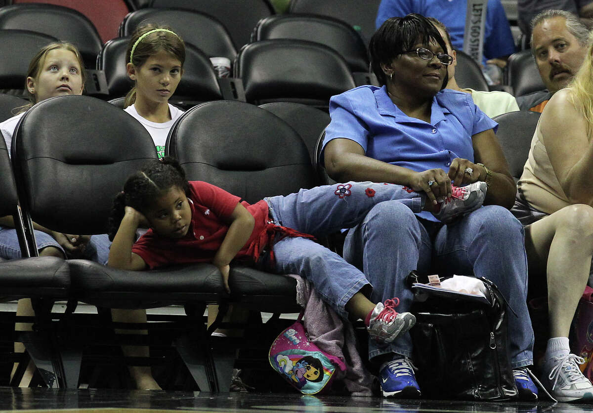 A young fan takes a casual view of the Silver Stars - Los Angeles Sparks game at the AT&T Center on Thursday, June 28, 2012. Silver Stars defeated the Sparks, 94-80.