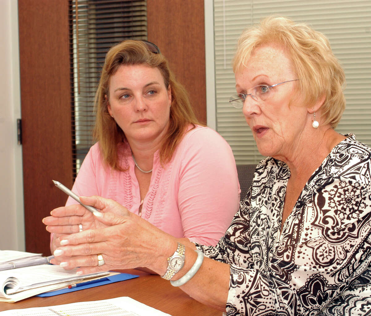 Board of Education Chairman Debbie Leidlein, left, and Newtown First Selectman Pat Llodra discuss the townís budget at a press conference Thursday afternoon, June 28, 2012.