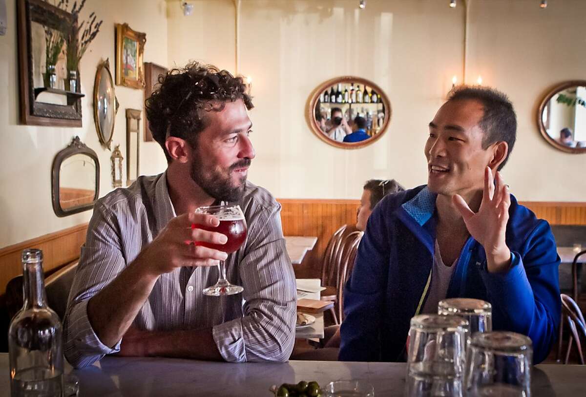 Nick Tumilowicz, left, and Joe Song have a beer at Fat Angel in San Francisco, Calif., on Wednesday, June 20th, 2012.