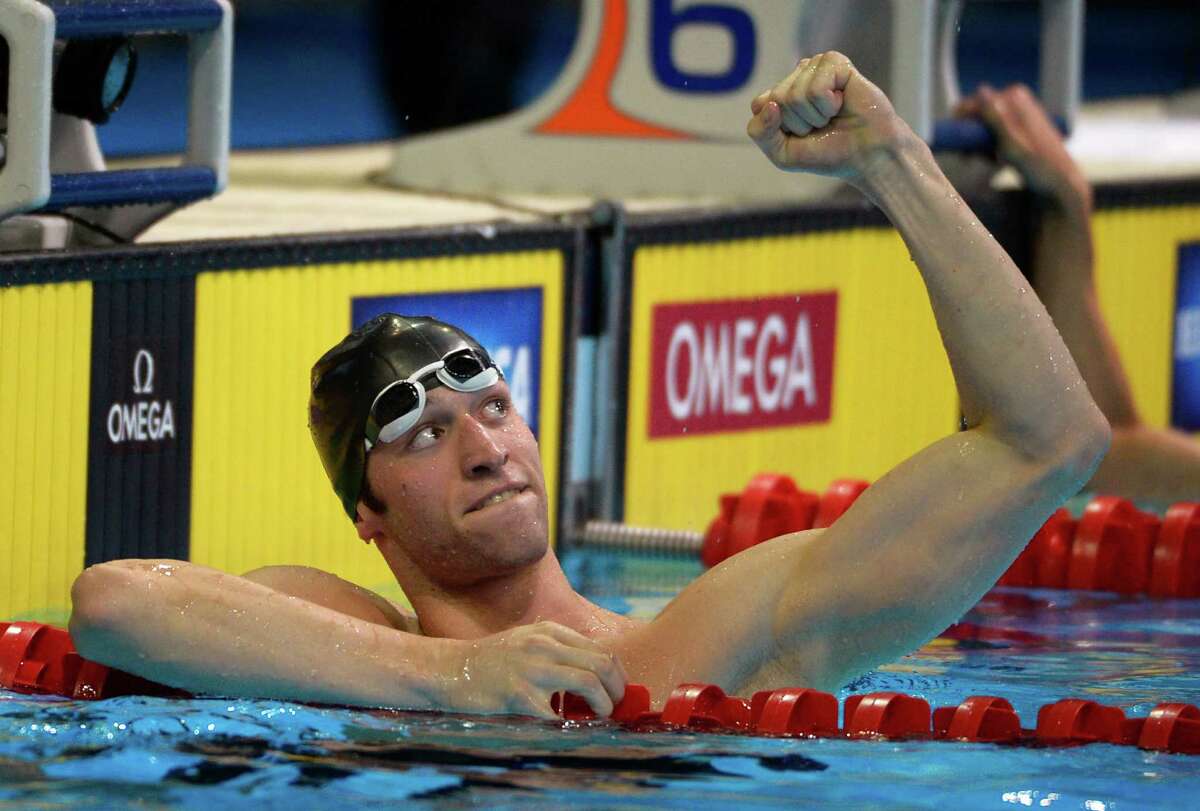 Austin Surhoff pumps his fist after swimming in a men's 200-meter individual medley semifinal at the U.S. Olympic swimming trials, Friday, June 29, 2012, in Omaha, Neb. (AP Photo/Mark J. Terrill)
