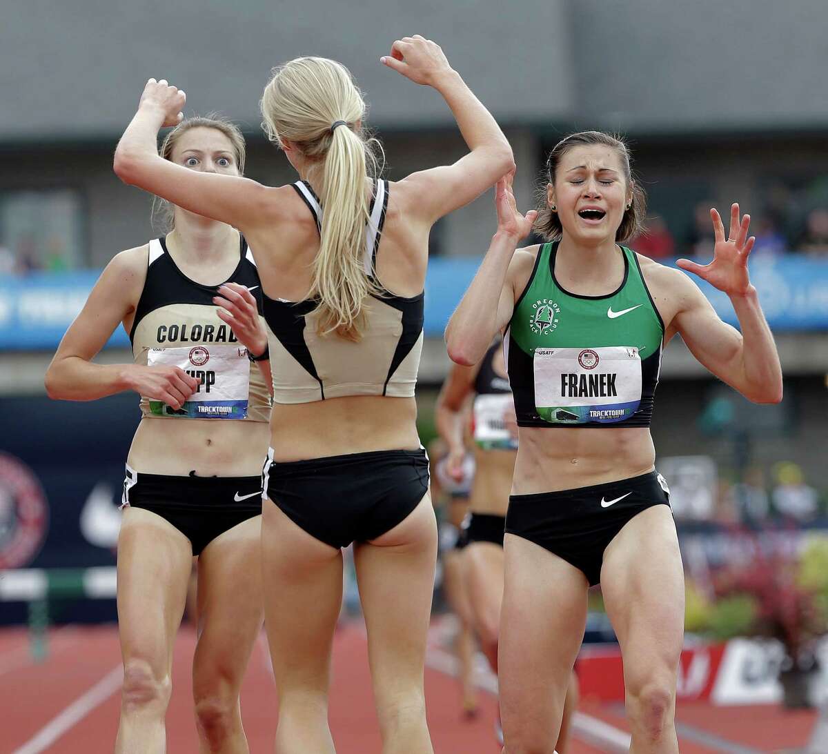 Shalaya Kipp, left, Bridget Franek, right, and Emma Coburn celebrate advancing to the Olympics after finishing the women's 3000 meter steeplechase at the U.S. Olympic Track and Field Trials Friday, June 29, 2012, in Eugene, Ore.(AP Photo/Eric Gay)