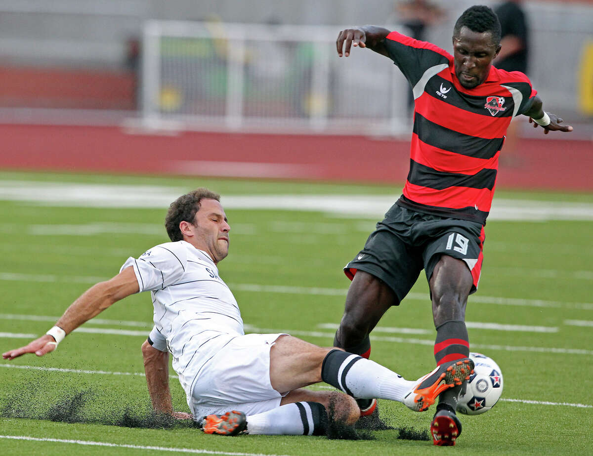 San Antonio's Kevin Harmse moves in to tackle Borfor Carr as the San Antonio Scorpions host the Atlanta Silverbacks at Heroes Stadium on June 30, 2012.