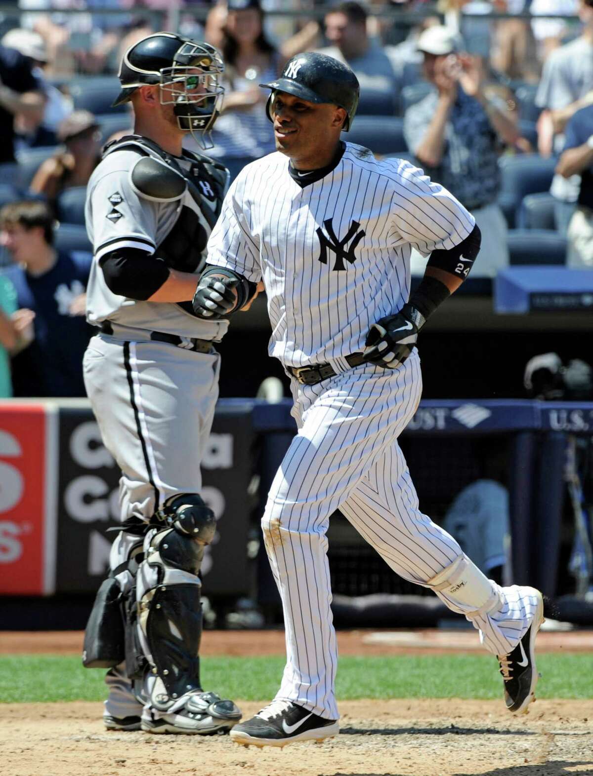 New York Yankees Robinson Cano hits an RBI single in the sixth