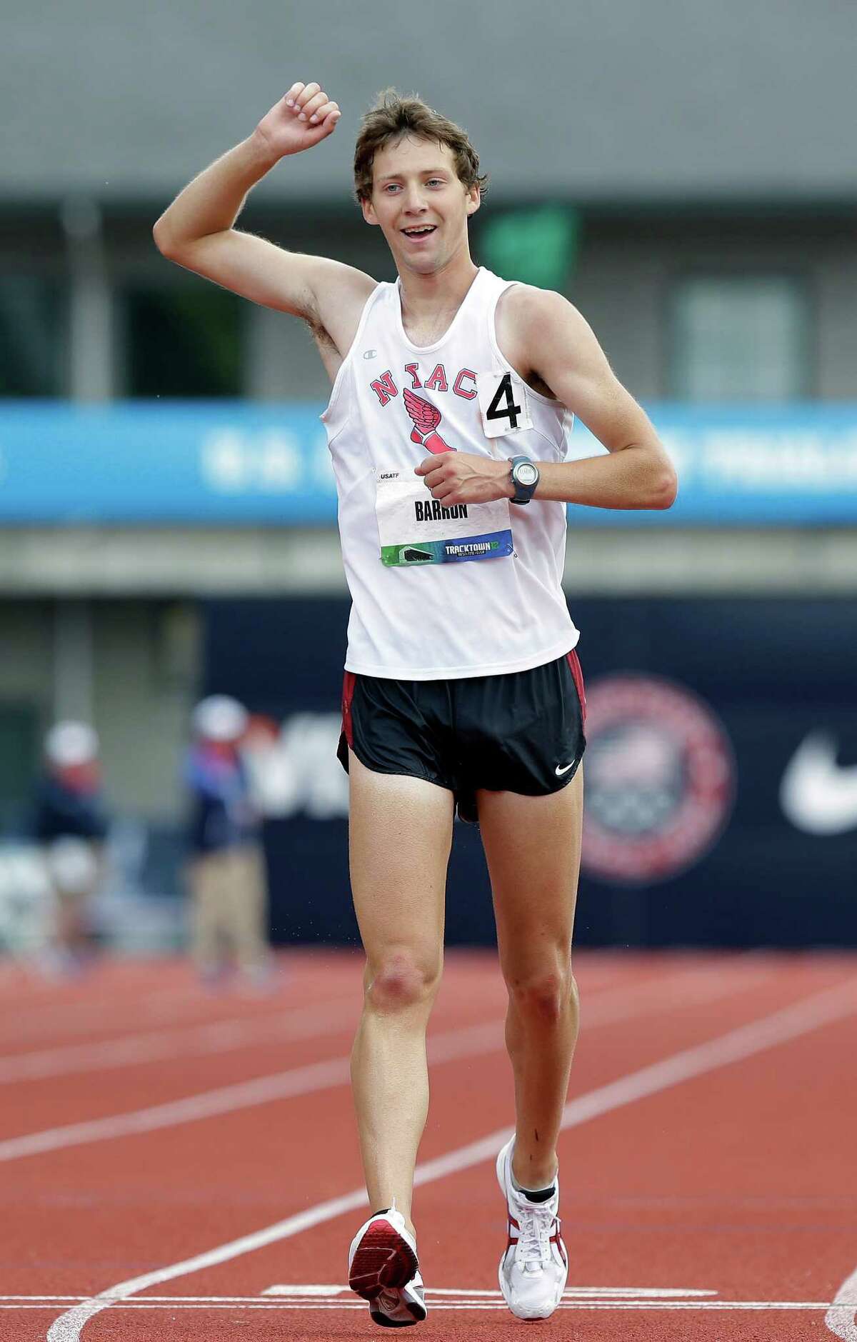 Trevor Barron celebrates as he crosses the finish line winning the men's 20 kilometer race walk at the U.S. Olympic Track and Field Trials athletics, Saturday, June 30, 2012, in Eugene, Ore. Barron won with a time of 1:23:00.10. (AP Photo/Eric Gay)