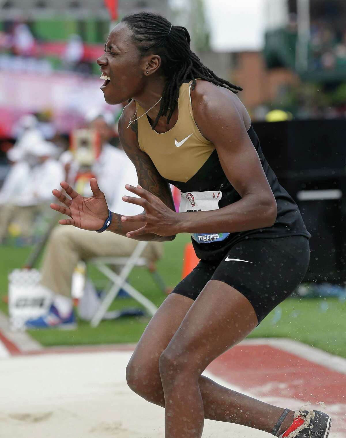Brittney Reese celebrates a jump in the women's long jump final at the U.S. Olympic Track and Field Trials Sunday, July 1, 2012, in Eugene, Ore. (AP Photo/Charlie Riedel)