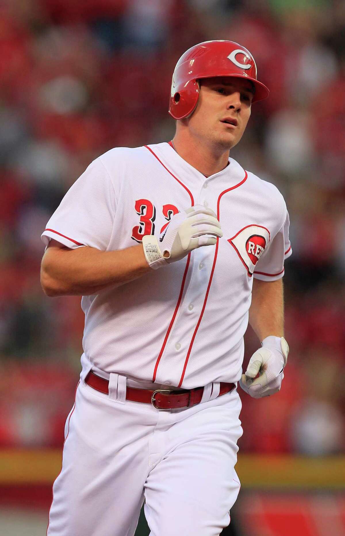 Cincinnati Reds' Jay Bruce rounds the bases after hitting a solo home run against the Milwaukee Brewers in a baseball game, Tuesday, June 26, 2012 in Cincinnati. (AP Photo/Al Behrman)
