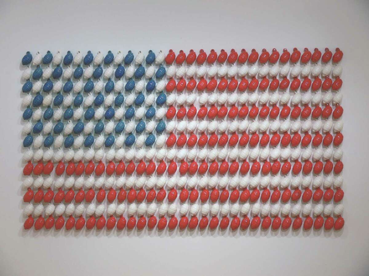 In "Stars and Stripes," Angela Carbone creates an American flag with ceramic grenades.
