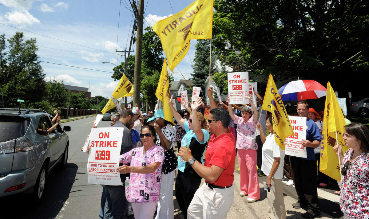Workers at Danbury Health Care Center on Osborne Street in Danbury went on strike at 6 a.m. Wednesday, July 3, 2012, and are protesting outside the health care facility. This is one of five in the state owned by HealthBridge - all on strike.