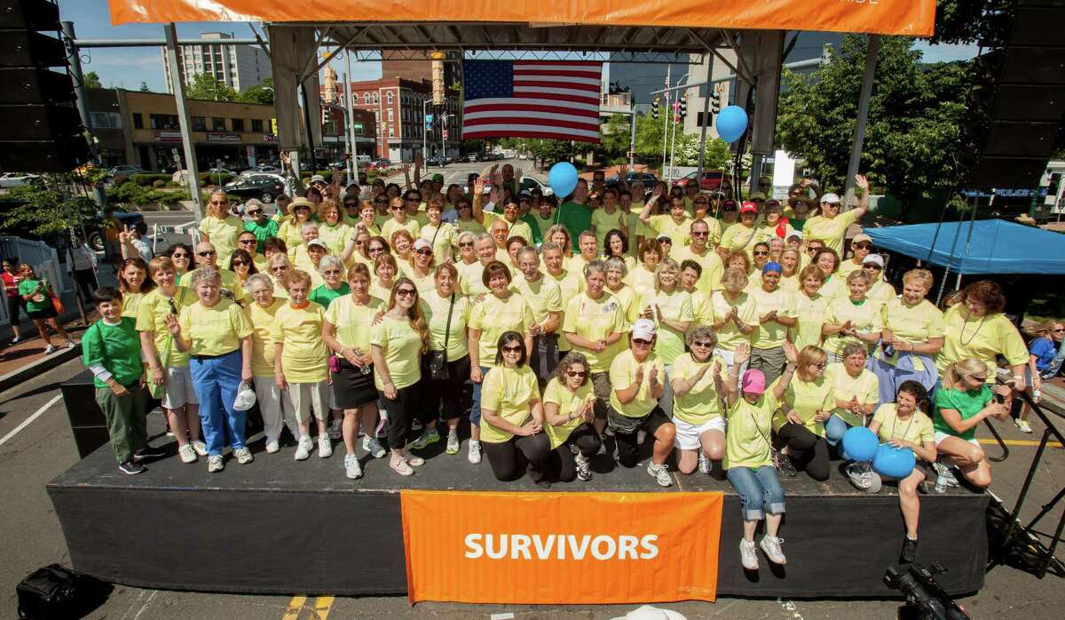 Cancer survivors gather for a photo at the 17th annual Hope in Motion Walk, Run & Ride June 3, 2012, at Columbus Park in Stamford, Conn. Photo by Richard Freeda.