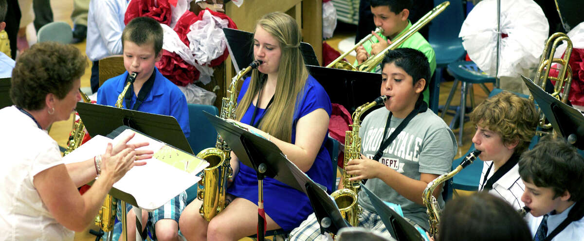 The school jazz band performs "Salute to Freedom," by Andy Clark, June 18, 2012 during the processional for Team Red and Team Blue's promotion ceremony at Schaghticoke Middle School in New Milford. Conducting the band is longtime Schaghticoke teacher and band director Cidny Iffland, who was set to retire last week.