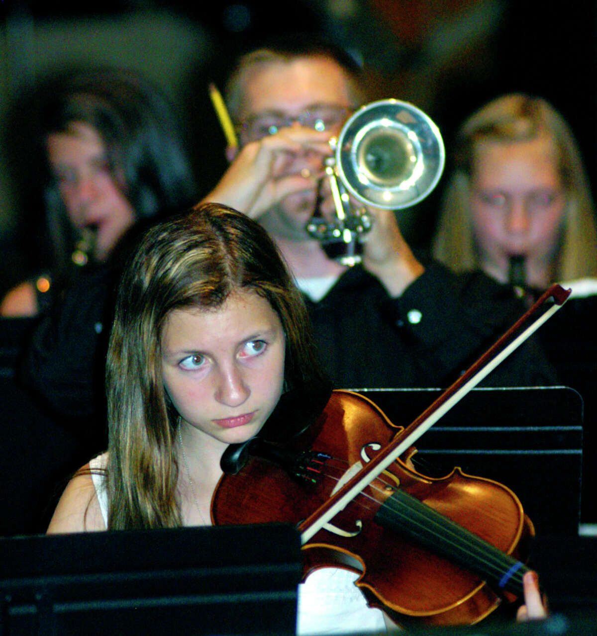 The school orchestra performs Bill Withers' "Lean on me" during the Shepaug Valley Middle School promotion ceremony, June 15, 2012