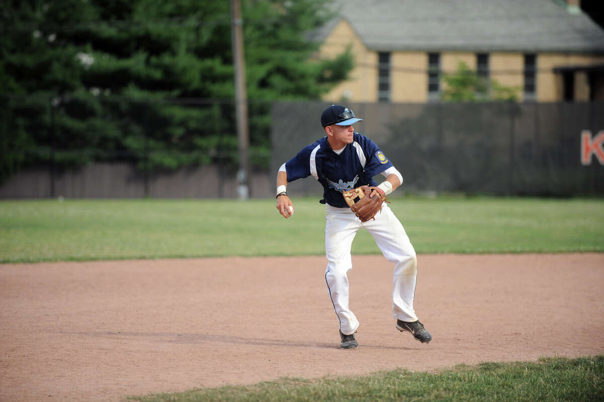 Stamford's Phil Damico turns the ball to first as Westport faces Stamford in a Senior American Legion Baseball game at Stamford High School in Stamford, Conn., July 3, 2012.