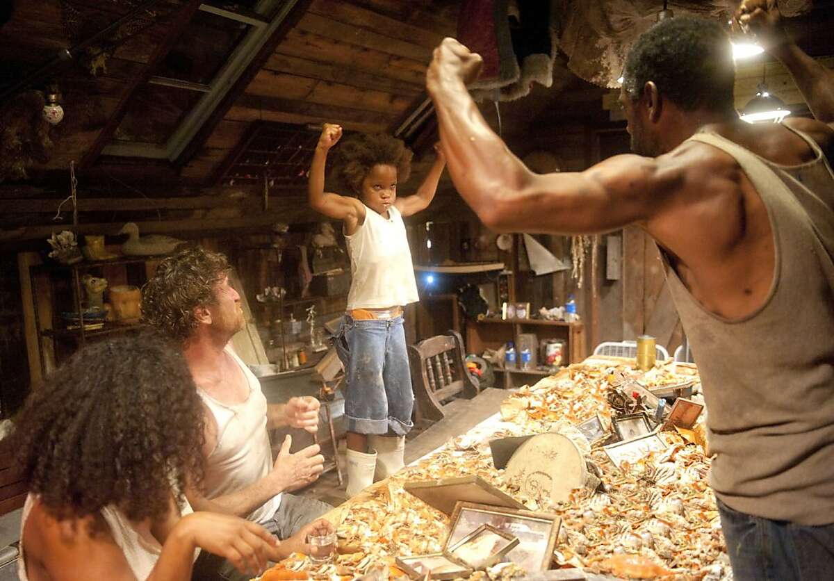 Quvenzhane Wallis as "Hushpuppy" and Dwight Henry as "Wink" on the set of BEASTS OF THE SOUTHERN WILD.