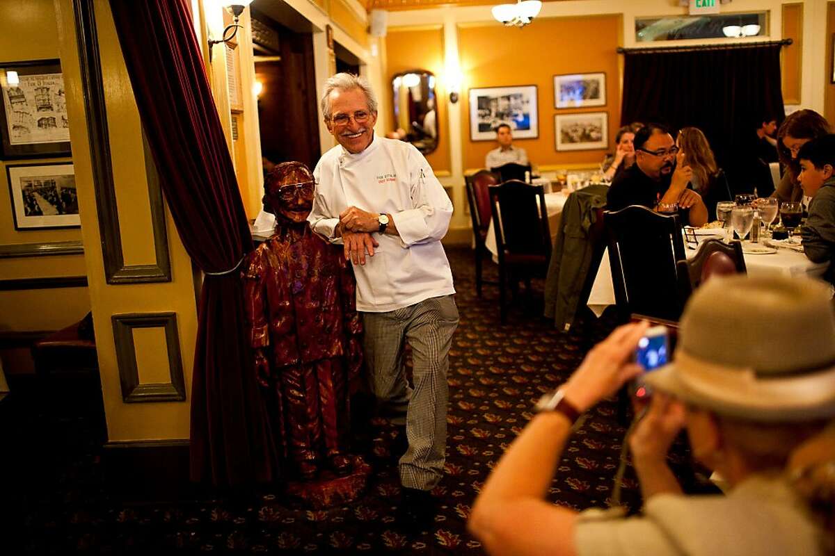 Head chef Gianni Audieri poses in front of a wooden sculpture of himself at Fior D'Italia restaurant in San Francisco, Calif., May 21, 2012. Jason Henry/Special to The Chronicle