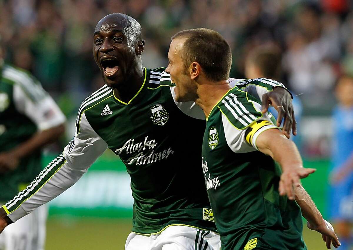 PORTLAND, OR - JULY 03: Jack Jewsbury #13 of the Portland Timbers celebrates his 2nd half goal with Mamadou Danso #98 against the San Jose Earthquakes on July 3, 2012 at Jeld-Wen Field in Portland, Oregon. (Photo by Jonathan Ferrey/Getty Images)