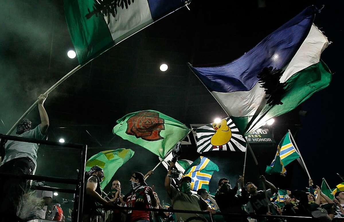 PORTLAND, OR - JULY 03: Fans of the Portland Timbers cheer against the San Jose Earthquakes on July 3, 2011 at Jeld-Wen Field in Portland, Oregon. (Photo by Jonathan Ferrey/Getty Images)