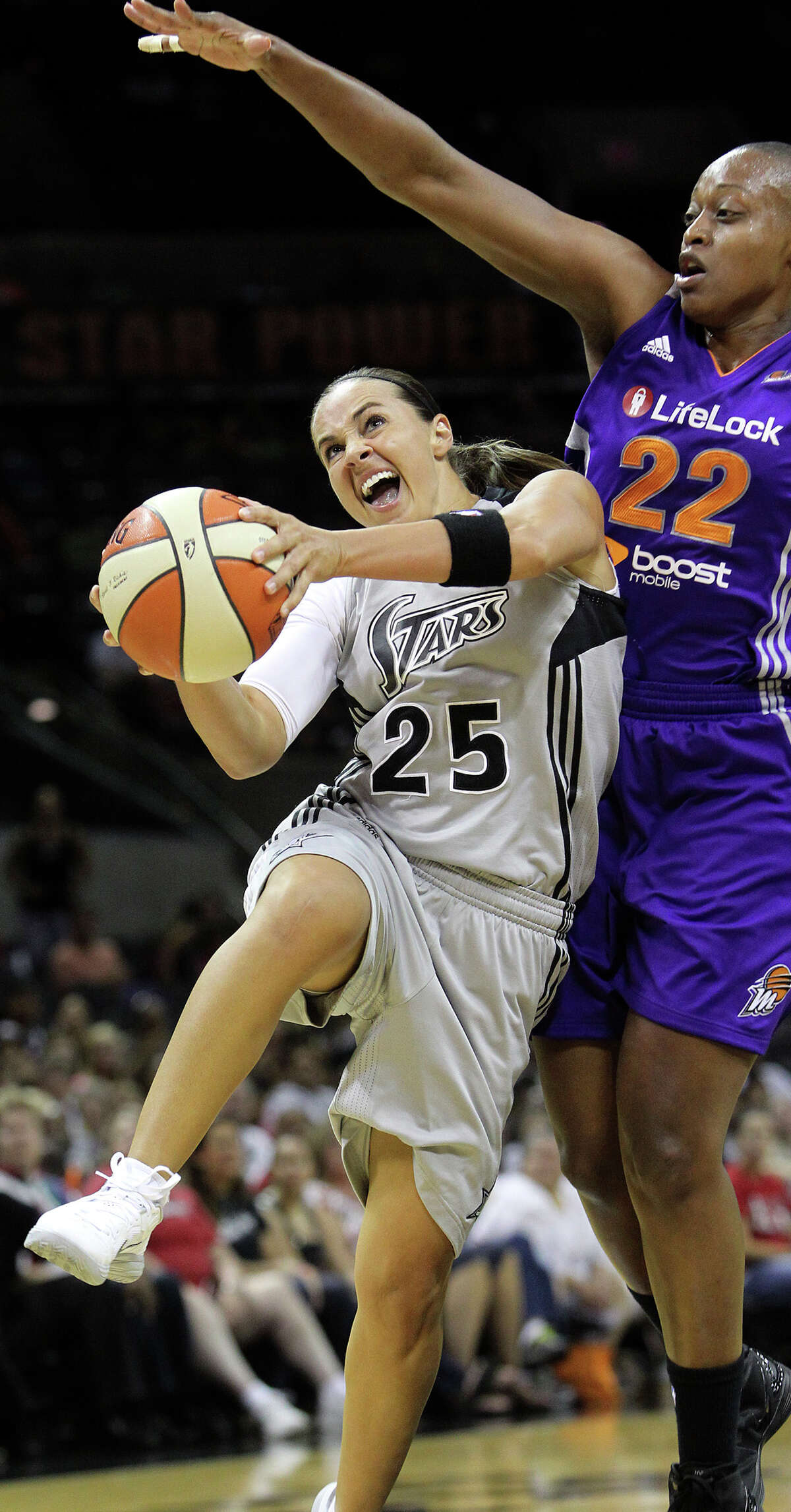 Becky Hammon rolls in for a bucket under Charde Houston as the Silver Stars host the Phoenix Mercury at the AT&T Center on July 3, 2012.