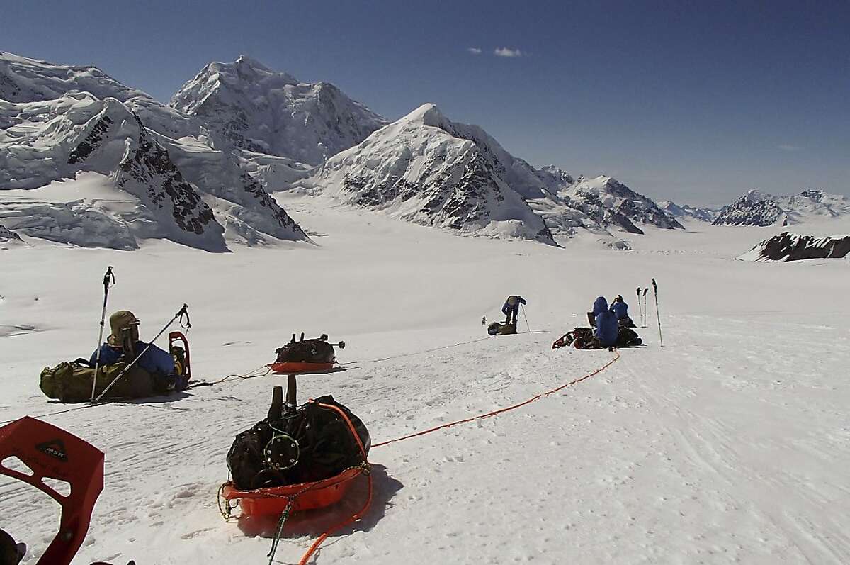 In this June 13, 2012, file photo provided by Disabled Sports USA, members of Warfighter Sports Denali Challenge pull gear while attempting to climb Mount McKinley in Alaska. The five men, all severely wounded in war, including four who had amputations, had to abandon their climb of North America's tallest peak, but say it was weather and not their disabilities that ended the summit attempt. The five men descended Alaska's Mount McKinley on Monday, July 2. (AP Photo/Disabled Sports USA, File)