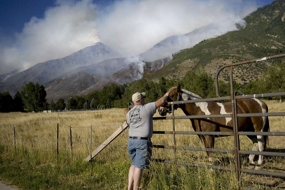 Firefighters in West hope for help from weather