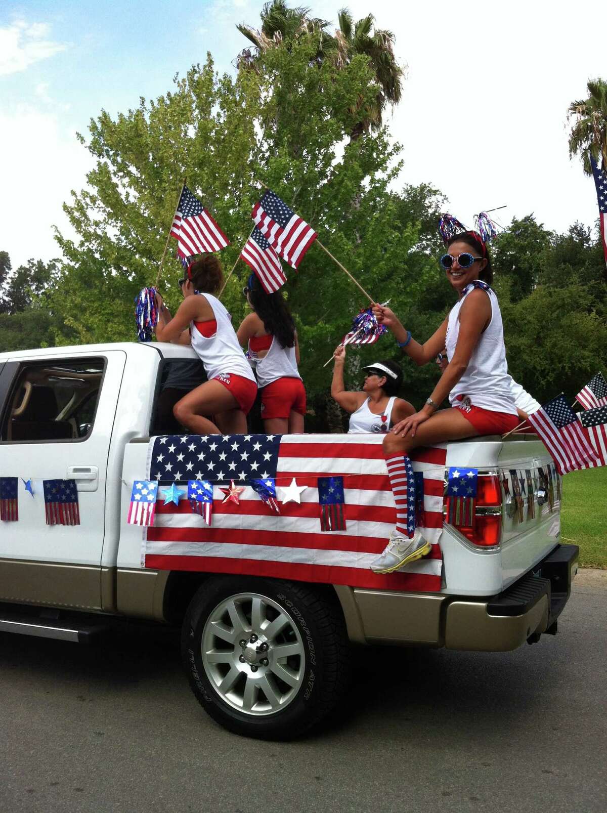 Terrell Hills youngsters show off their patriotic spirit during the city’s annual Fourth of July parade Wednesday.