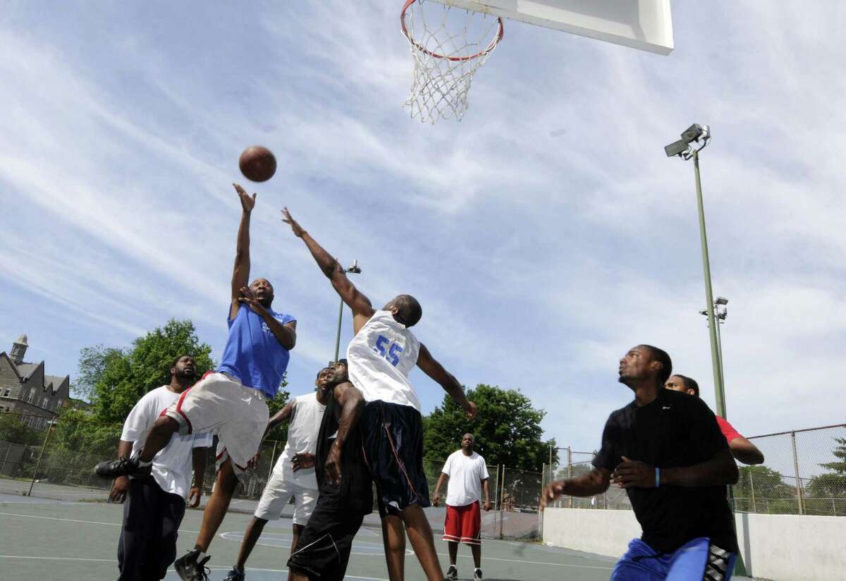 A game of pickup basketball played every weekend on the courts at Washington Park in Albany N.Y. Saturday June 30, 2012. (Michael P. Farrell/Times Union)