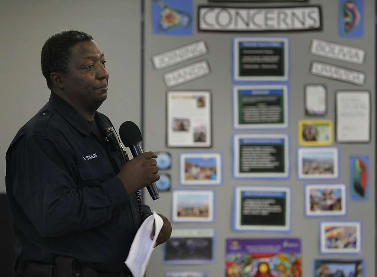Oakland police services technician Eddie Simlin speaks to a group of residents at a home video surveillance system workshop in Oakland, Calif. on Saturday, June 30, 2012. Concerned with soaring a crime rate, Oakland Hills residents are looking at security cameras as an effective crime-prevention measure.