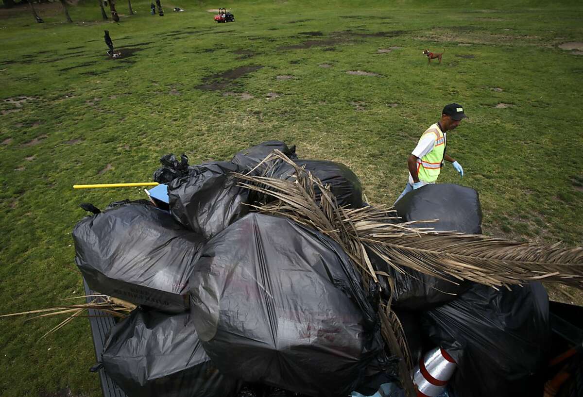 Edward Speller with San Francisco Recreation and Park cleans up the mess left in Dolores Park from the Fourth of July holiday in San Francisco, Calif., Thursday, July 5, 2012. "These parks are everybody's," he said, "I don't get why you would treat your home that way."