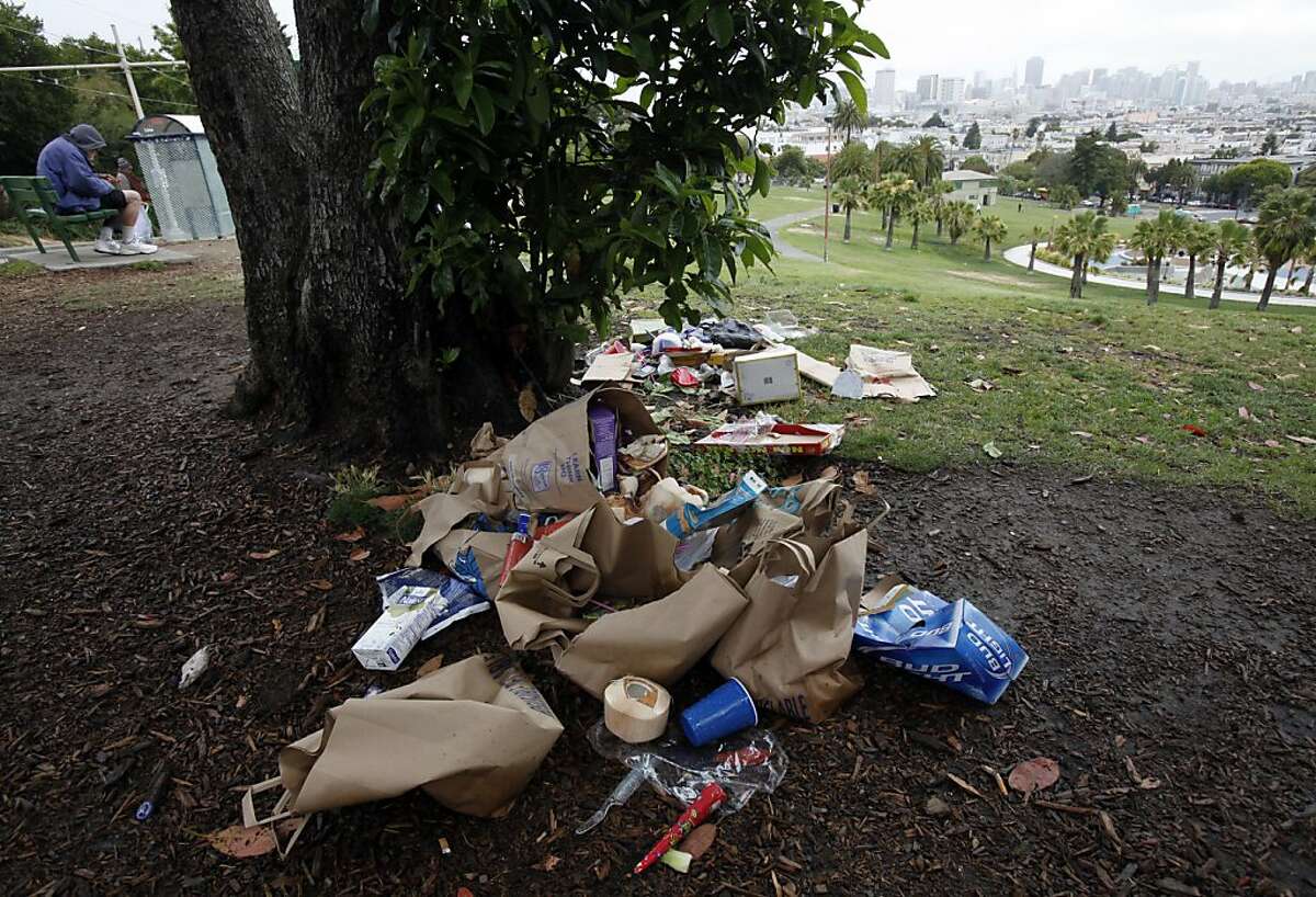 Trash left by Fourth of July revelers sits in Dolores Park in San Francisco, Calif., Thursday, July 5, 2012. San Francisco Recreation and Park crews were on hand at six in the morning to start cleaning up the mess.
