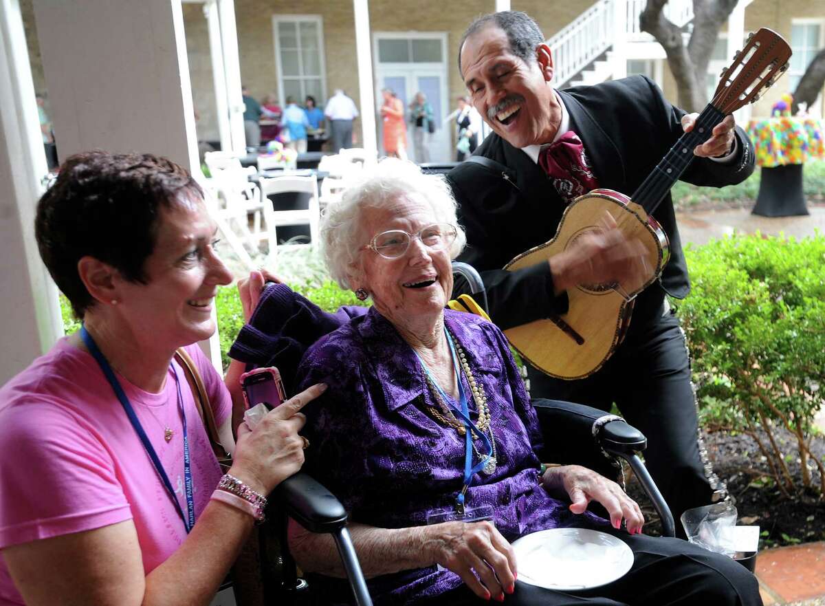 Grace Harlan Bristol, who is 99 years old, and her granddaughter, Elizabeth Parks, enjoy Jesus Magallanes and the Mariachi Los Gallos de Jalisco during the Harlan Family Reunion at the Marriott Plaza Hotel on July 5, 2012. The original Harlans were Quakers and came to Americas in search of religious freedom. They arrived at William Penn's Colony at New Castle, Delaware, in 1687, according to the family website.