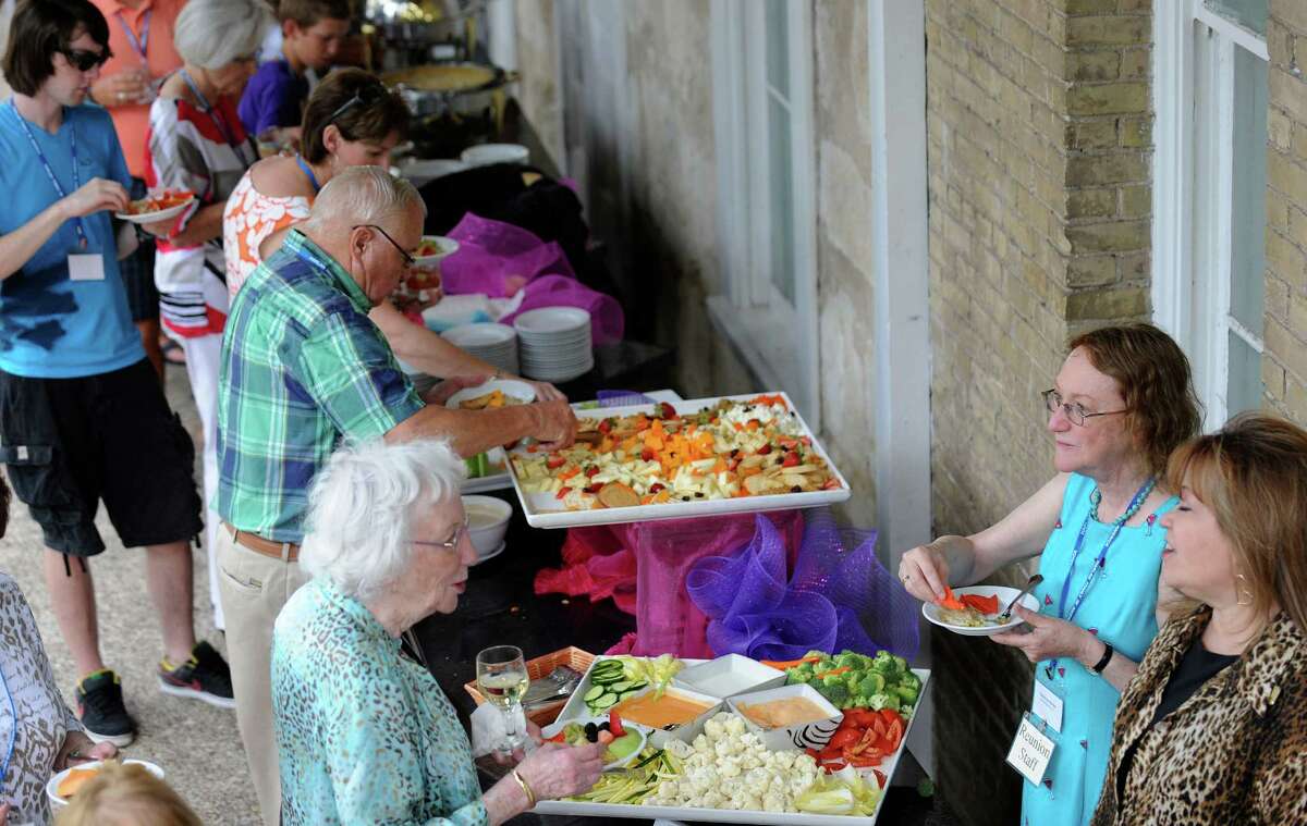 People at the Harlan family reunion enjoy food at the Marriott Plaza Hotel on July 5, 2012. The original Harlans were Quakers and came to Americas in search of religious freedom. They arrived at William Penn's Colony at New Castle, Delaware, in 1687, according to the family website.