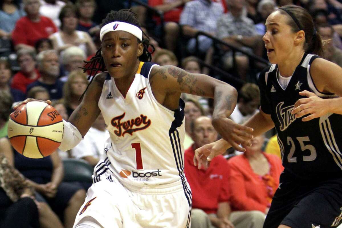 Indian Fever's Shavonte Zellous (1) drives around San Antonio Silver Stars defender Becky Hammon (25) during the second half of an WNBA basketball game, Thursday, July 5, 2012, in Indianapolis.