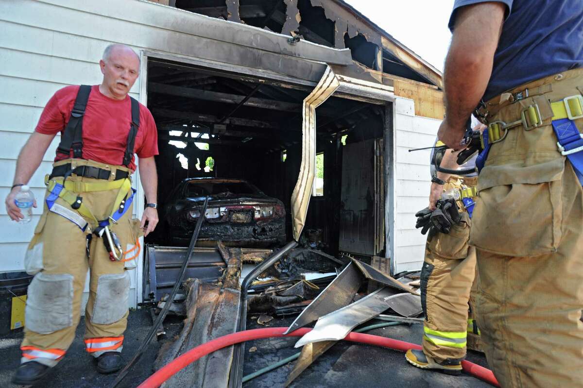 Coals linked to car, garage fire