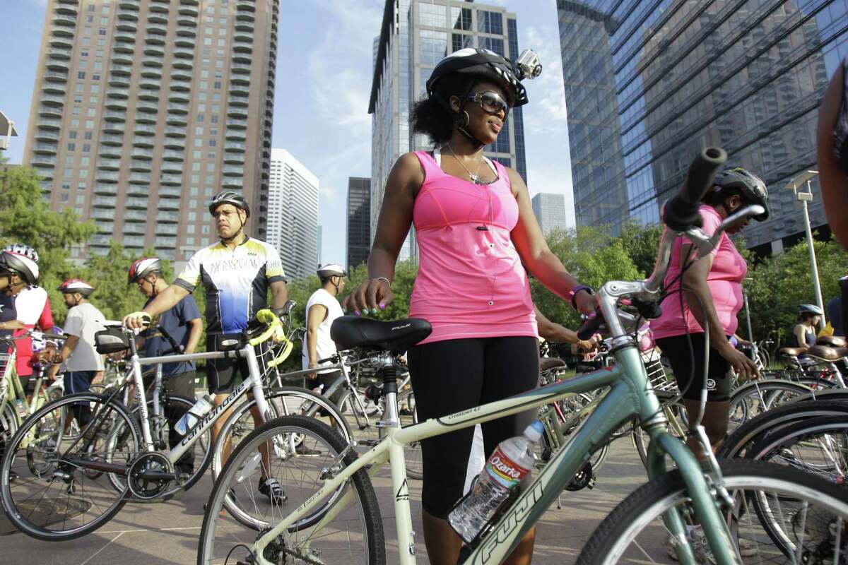 Mitzi Henderson of Houston prepares to start the NAACP National Convention Bike Ride at Discovery Green. The convention began Saturday.