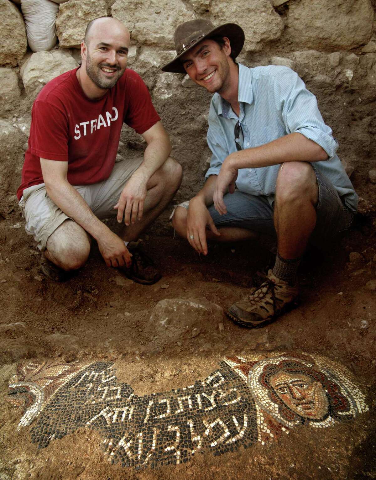 Professor Chad Spigel and student Joshua Pedrick with the Huqoq mosaic. Photo by Jim Haberman/courtesy photo