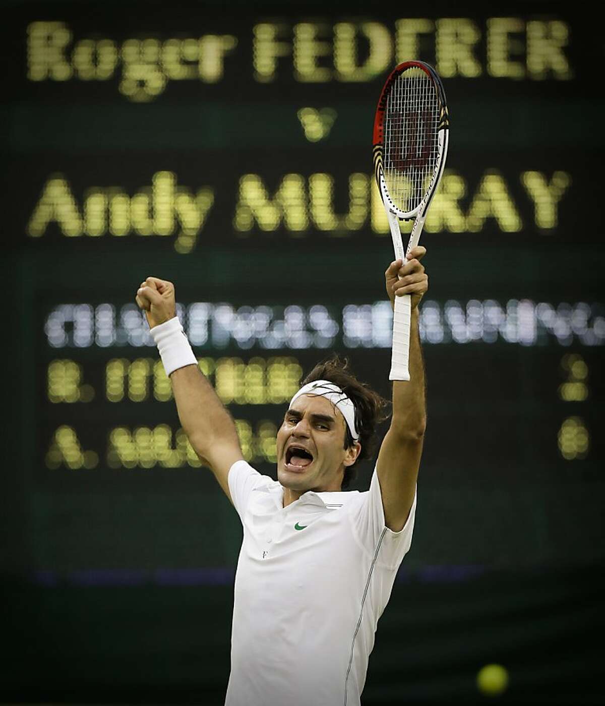Roger Federer of Switzerland celebrates winning the men's singles final against Andy Murray of Britain at the All England Lawn Tennis Championships at Wimbledon, England, Sunday, July 8, 2012. (AP Photo/Anja Niedringhaus)