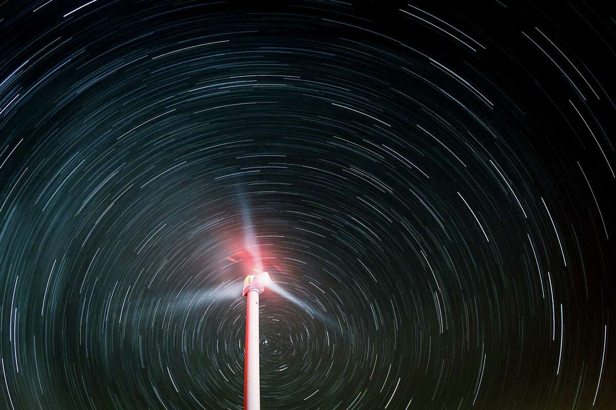 Star trails illuminate the sky as a wind turbine generates electricity during a 60-minute exposure at the BP Sherbino Mesa II Wind Farm, Sunday, Feb. 19, 2012, in Fort Stockton. After cutting its solar program last year, BP is beefing up its investments into wind energy and recently launched its fourth Texas wind farm, in Fort Stockton. On 20,000 acres in Pecos County, the Sherbino II farm has 60 wind turbines to generate enough electricity to power more than 175,000 homes.