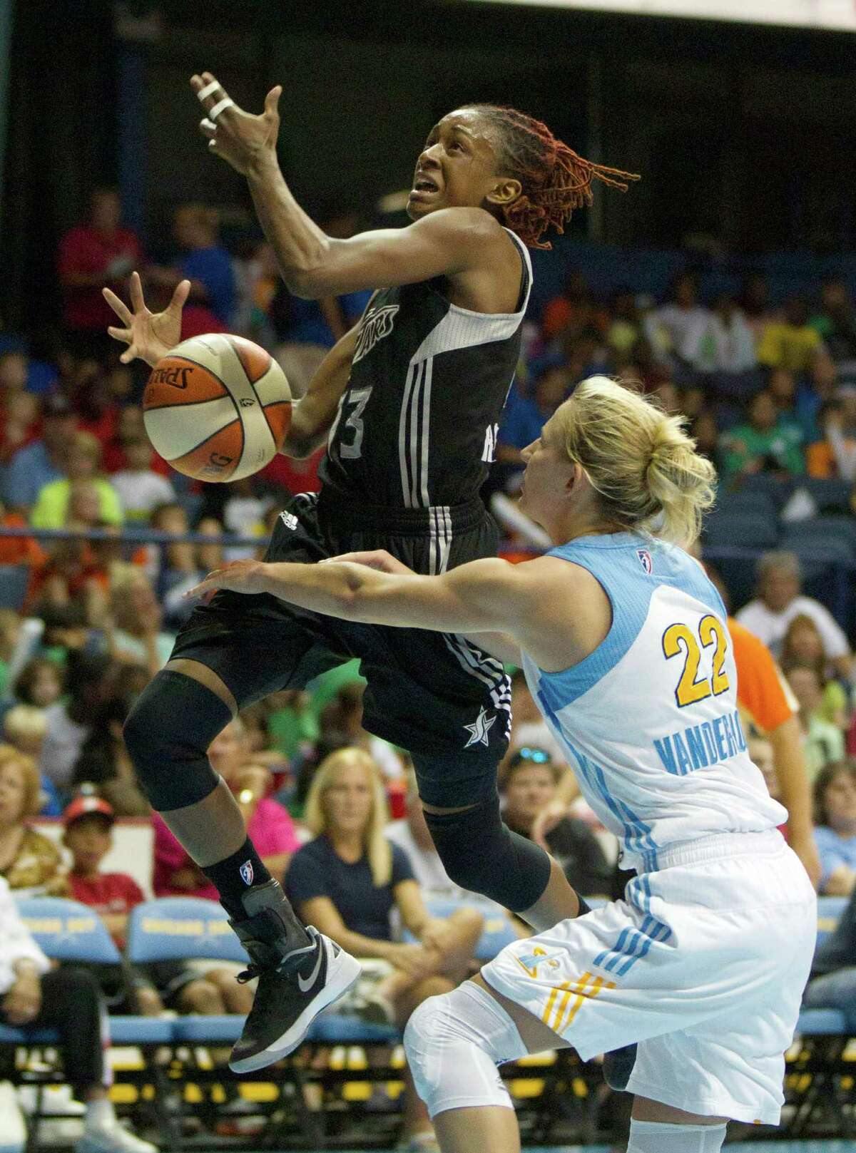 San Antonio Silver Stars' Danielle Robinson, left, is fouled by Chicago Sky's Courtney Vandersloot during the first half of an WNBA basketball game, Wednesday, July 11, 2012, in Rosemont, Ill. (AP Photo/Charles Rex Arbogast)