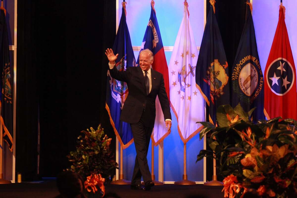 Vice President Joe Biden waves to the crowd as he prepares to address the NAACP convention in Houston Thursday morning.