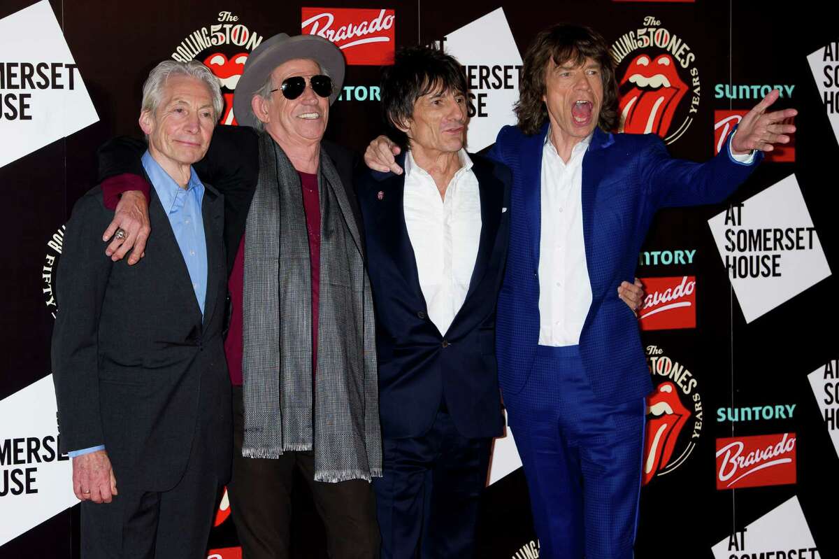 From left, Charlie Watts, Keith Richards, Ronnie Wood and Mick Jagger, from the British Rock band The Rolling Stones, arrive at a central London venue, to mark the 50th anniversary of the Rolling Stones first performance, Thursday, July 12, 2012. (AP Photo/Jonathan Short)