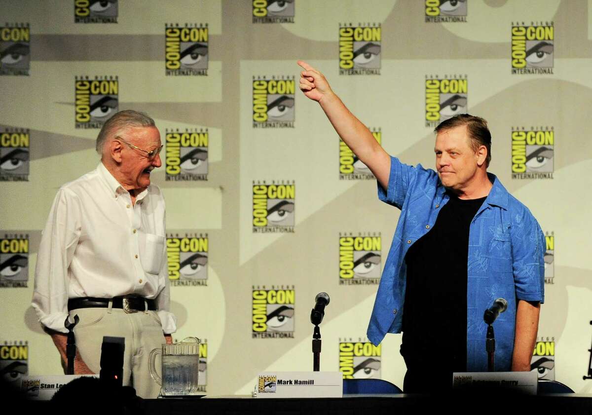 Actor Mark Hamill, right, points to the crowd as Stan Lee, right, looks on at the start of the Stan Lee's World of Heroes panel on the first day of Comic-Con convention held at the San Diego Convention Center on Thursday July 12, 2012, in San Diego. (Photo by Denis Poroy/Invision/AP)
